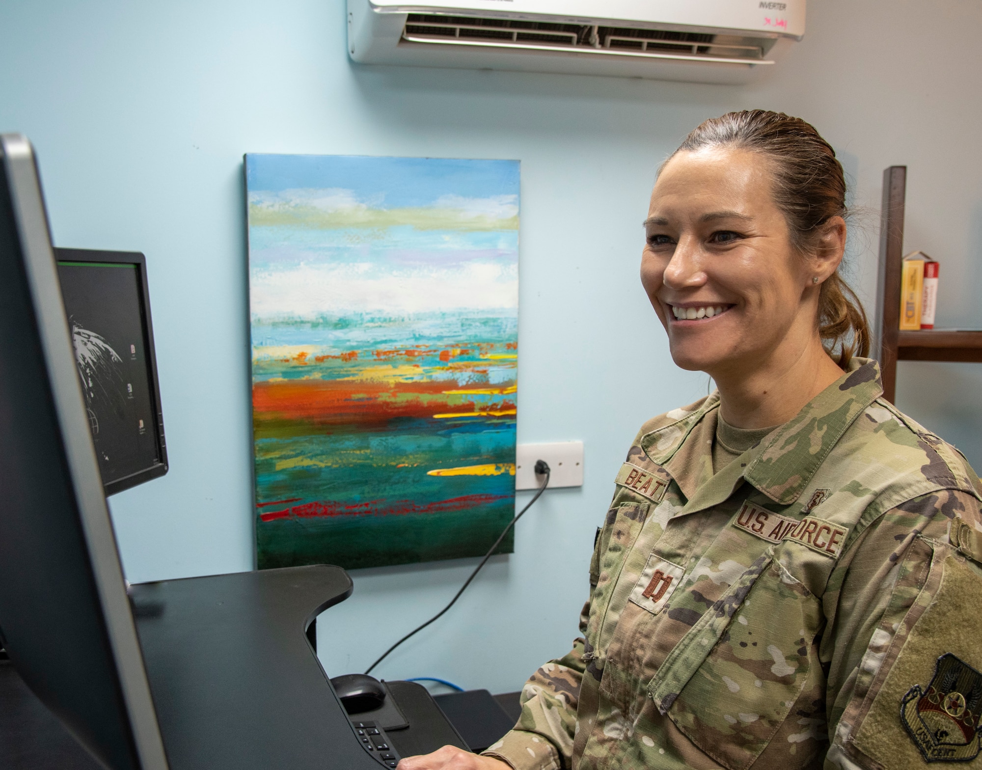 U.S. Air Force Capt. Suzan Beattie, 332d Expeditionary Medical Squadron Chief of Mental Health in her office at an undisclosed location in Southwest Asia, Sept. 9, 2022. Beattie is one of the professionals responsible for suicide prevention and other mental healthcare at the 332d Air Expeditionary Squadron. (U.S. Air Force photo by: Tech. Sgt. Jim Bentley)