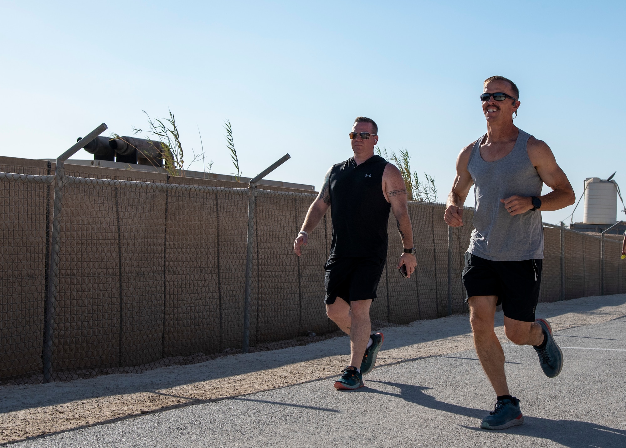 Red Tail Shield, the Chapel Corps, and Mental Health personnel at the 332d Air Expeditionary Wing host a 2.2 kilometer or 22 lap fun run for Suicide Prevention Awareness Month at an undisclosed location in Southwest Asia, Sept. 22, 2022. The run is being held to connect airmen to agencies that seek to address the causes of suicide before it is too late. Airmen run either 2.2 kilometers or 22 laps around the track to memorialize the 22 veterans who commit suicide daily on average. (U.S. Air Force photo by: Tech. Sgt. Jim Bentley)