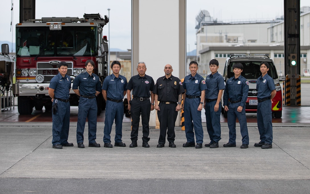 Members of the Marine Corps Air Station Iwakuni Fire Department pose for a group photo in front of Fire Station 1 at MCAS Iwakuni, Japan, Sept. 29, 2022. The fire department safeguards property and personnel from emergency situations by providing all-hazard response services. To increase the community’s knowledge on fire prevention and education, the fire station hosts open houses and teaches classes throughout the year.