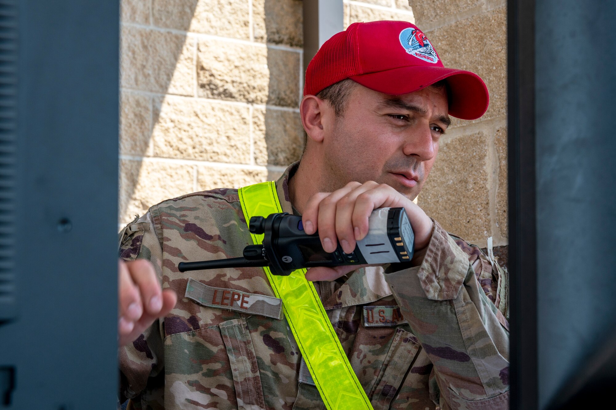 U.S. Air Force Tech. Sgt. Gustavo Lepe, an 823d Rapid Engineer Deployable Heavy Operational Repair Squadron Engineer (RED HORSE) information technology system section chief, directs flow of communication while coordinating cargo procedures during an equipment processing training exercise Sept. 26-27, 2022, at Hurlburt Field, Florida. The exercise tested the unit’s ability to recall, prepare and deploy Unit Training Codes requirements based on response times from the unit’s Design Operational Capability. Exercising these skills is essential during the 800th Red Horse Group’s ongoing effort to reorganize its UTCs to better support combatant commanders with worldwide construction capabilities. The 800th RHG is based at Nellis Air Force Base, Nevada.