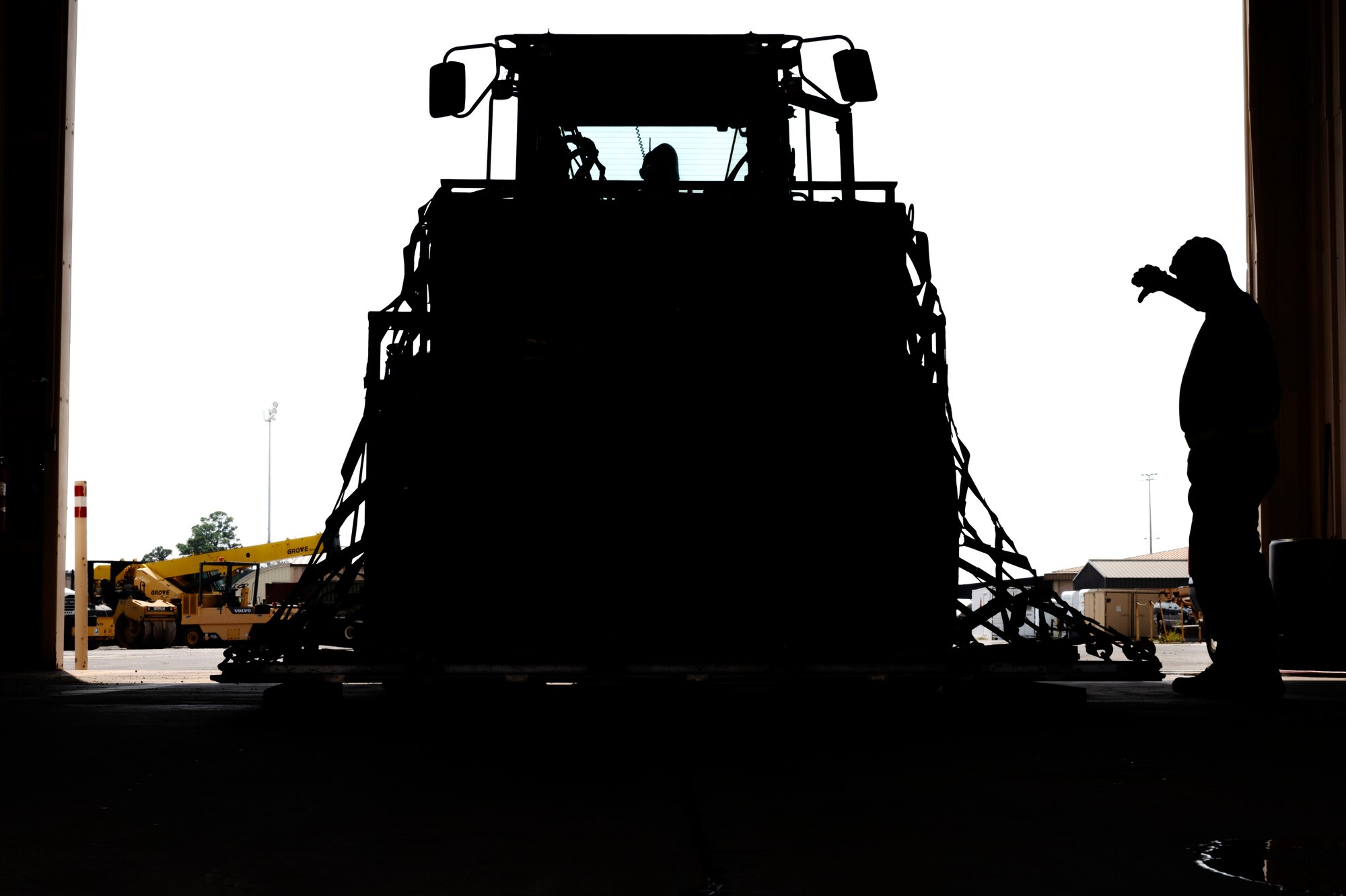 An Airman assigned to the 823d Rapid Engineer Deployable Heavy Operational Repair Squadron Engineer (RED HORSE) directs a 10k forklift driver to lower the cargo unit for inspection during an equipment processing training exercise Sept. 26-27, 2022, at Hurlburt Field, Florida. The exercise tested the unit’s ability to recall, prepare and deploy Unit Training Codes requirements based on response times from the unit’s Design Operational Capability. Exercising these skills is essential during the 800th Red Horse Group’s ongoing effort to reorganize its UTCs to better support combatant commanders with worldwide construction capabilities. The 800th RHG is based at Nellis Air Force Base, Nevada.