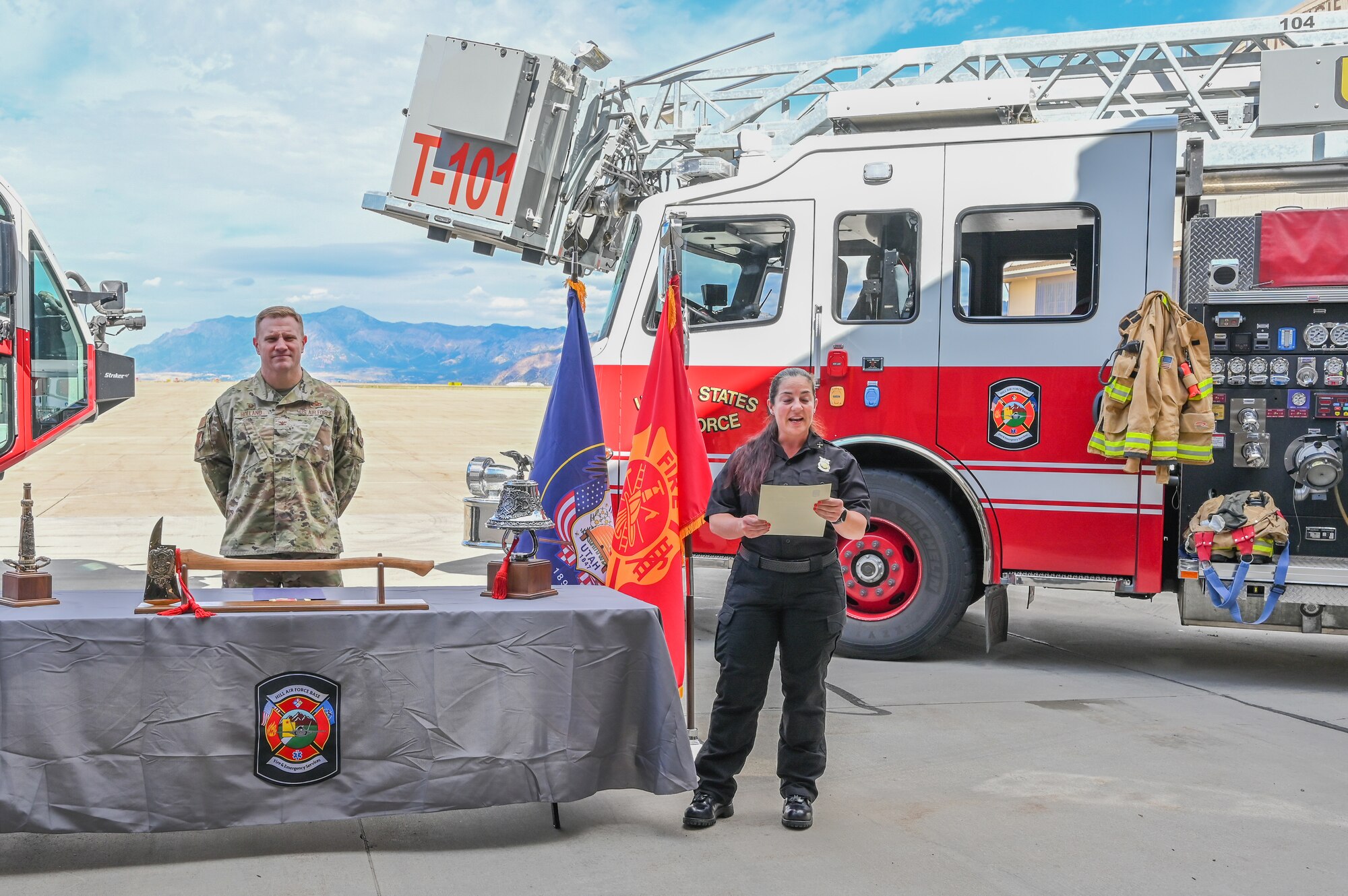 Tiana Bykowski, 775th CES training officer, reads aloud the proclamation Sept. 29, 2022, designating Oct. 9-15 as Fire Prevention Week at Hill Air Force Base, Utah, with Col. Jeffrey Holland, 75th Air Base Wing commander presiding.