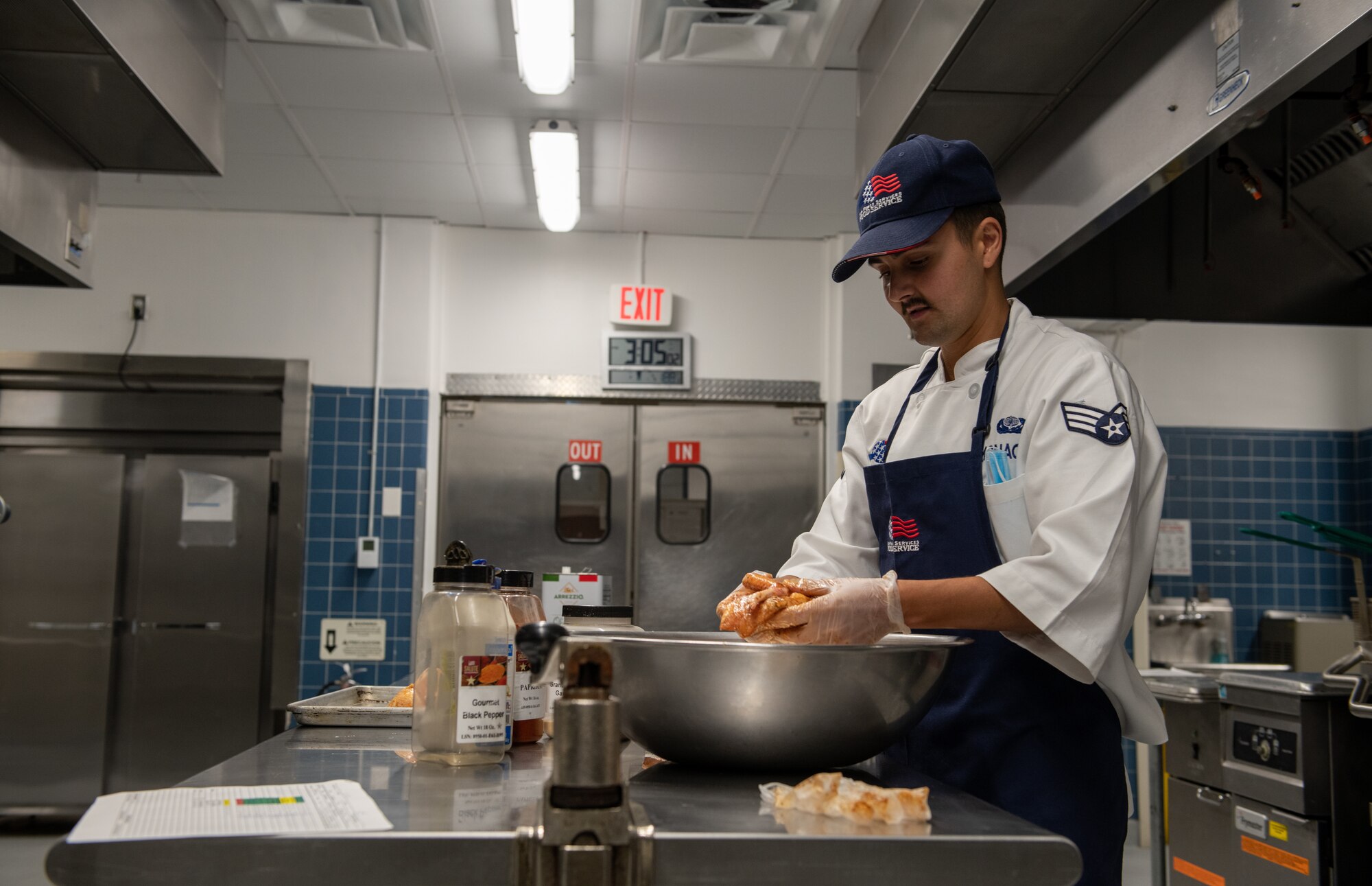 Cook prepares chicken