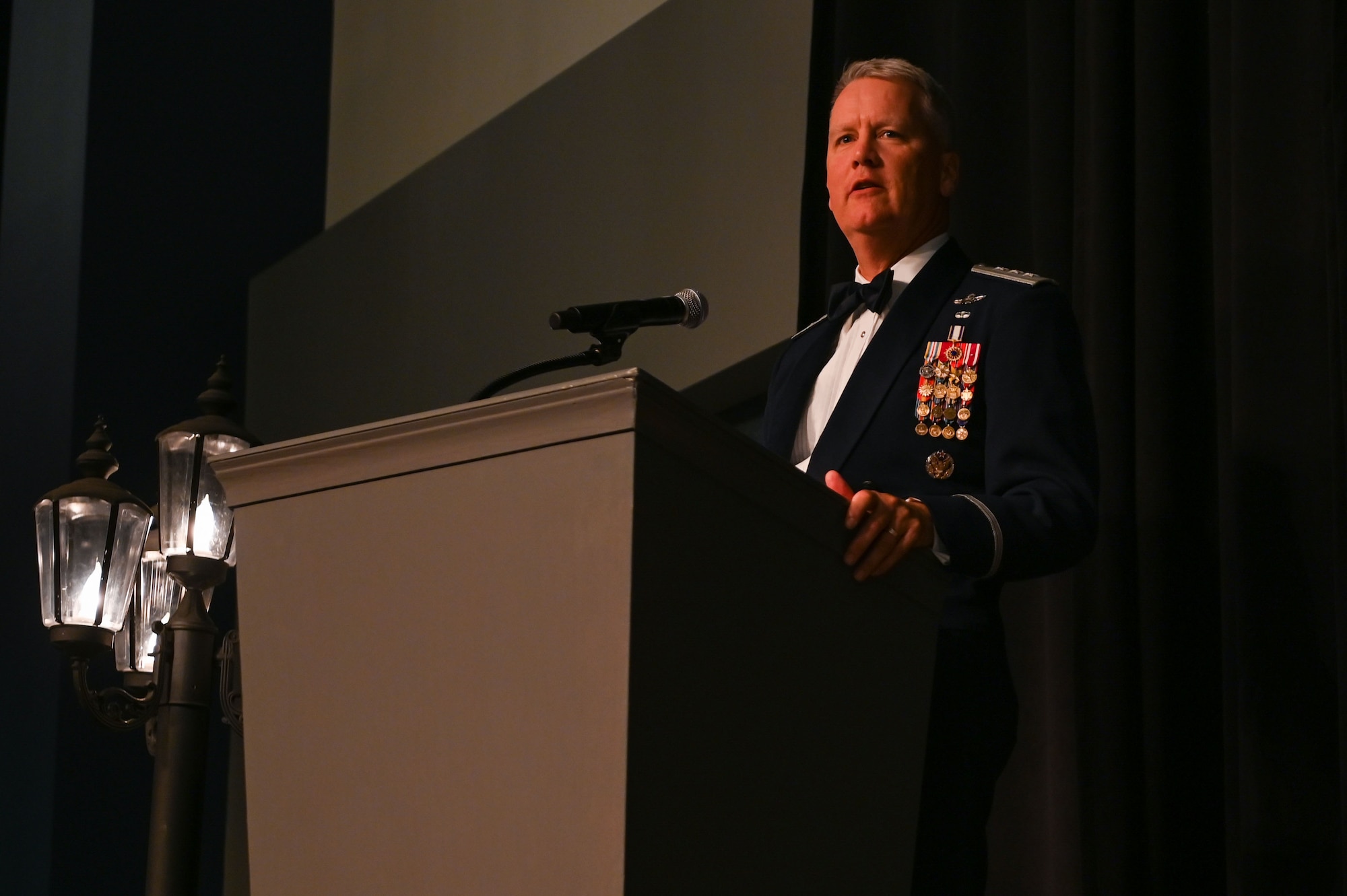 Lt. Gen. James Jacobson, Pacific Air Forces deputy commander, speaks in front of attendees at Fairchild’s 75th Anniversary Air Force Ball at the Spokane Convention Center, Spokane, Washington, Sept. 24, 2022. Jacobson has recorded more than 4,100 total flying hours and flown combat missions for operations Desert Shield, Allied Forces and Enduring Freedom. (U.S. Air Force photo by Airman 1st Class Morgan Dailey)