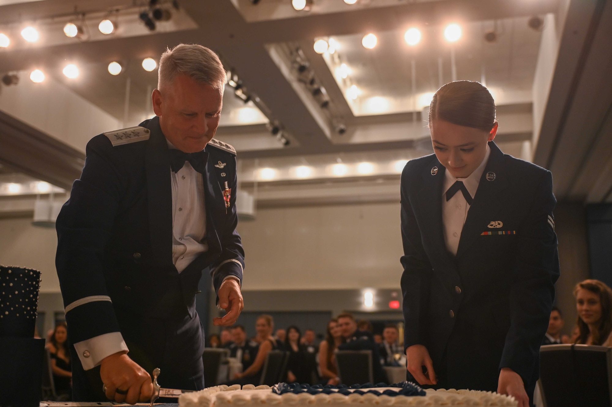 Lt. Gen. James Jacobson, Pacific Air Forces deputy commander, speaks in front of attendees at Fairchild’s 75th Anniversary Air Force Ball at the Spokane Convention Center, Spokane, Washington, Sept. 24, 2022. Jacobson has recorded more than 4,100 total flying hours and flown combat missions for operations Desert Shield, Allied Forces and Enduring Freedom. (U.S. Air Force photo by Airman 1st Class Morgan Dailey)