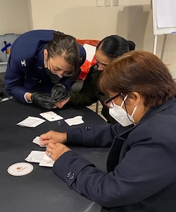 Col. Michelle Flores, director of Defense Institute for Medical Operations, demonstrates a malaria rapid diagnostic test in May 2022, during 
the Malaria and Other Infectious Disease Threats course held in Lima, Peru. (U.S. Air Force photo / Joshua Moreno,)