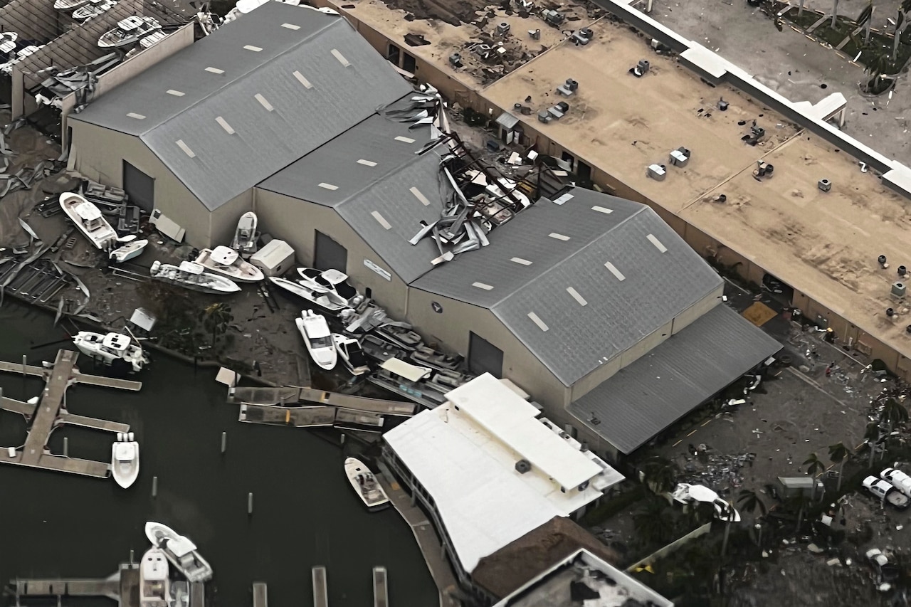Boats damaged by a hurricane are seen from overhead.