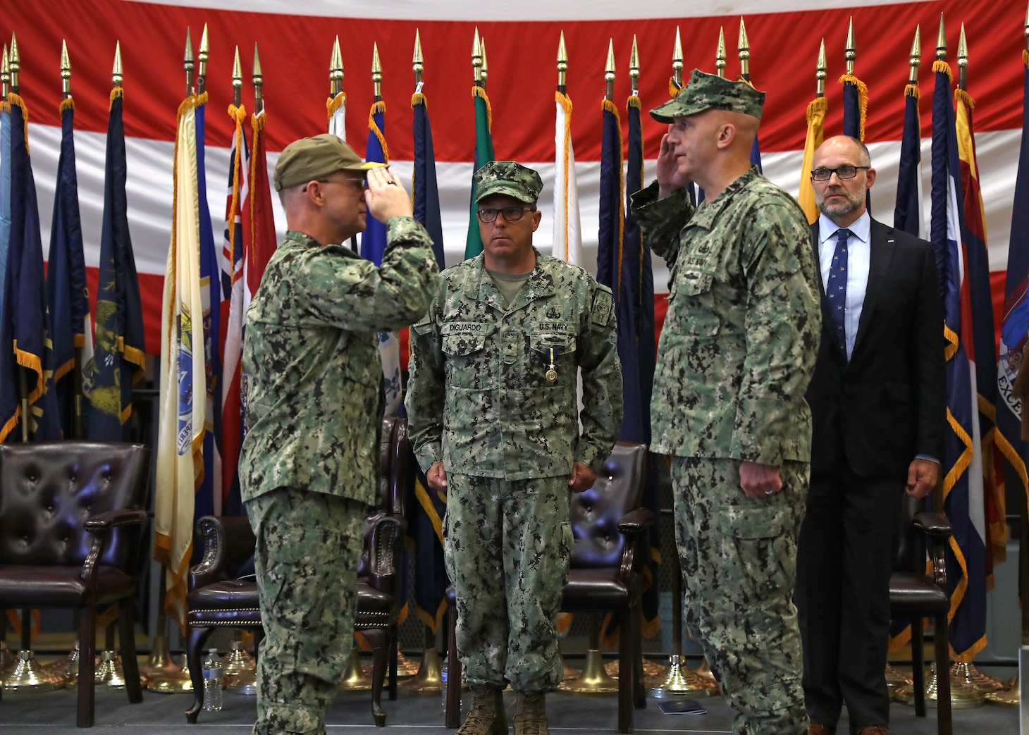 Rear Adm. Bradley Andros, renders a salute to Adm. Daryl Caudle, commander, U.S. Fleet Forces Command, after relieving Rear Adm. Joseph DiGuardo as commander, Navy Expeditionary Combat Command (NECC), during a ceremony at Assault Craft Unit 4 onboard Joint Expeditionary Base Little Creek-Fort Story, Sept. 30.