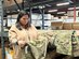 Alexandra Reyes inspects a maternity Operational Camouflage Pattern trouser