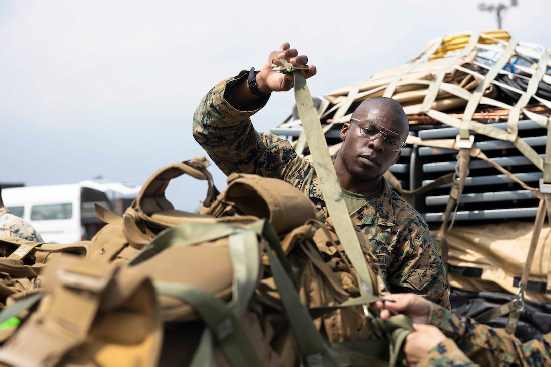 A Marine secures equipment.