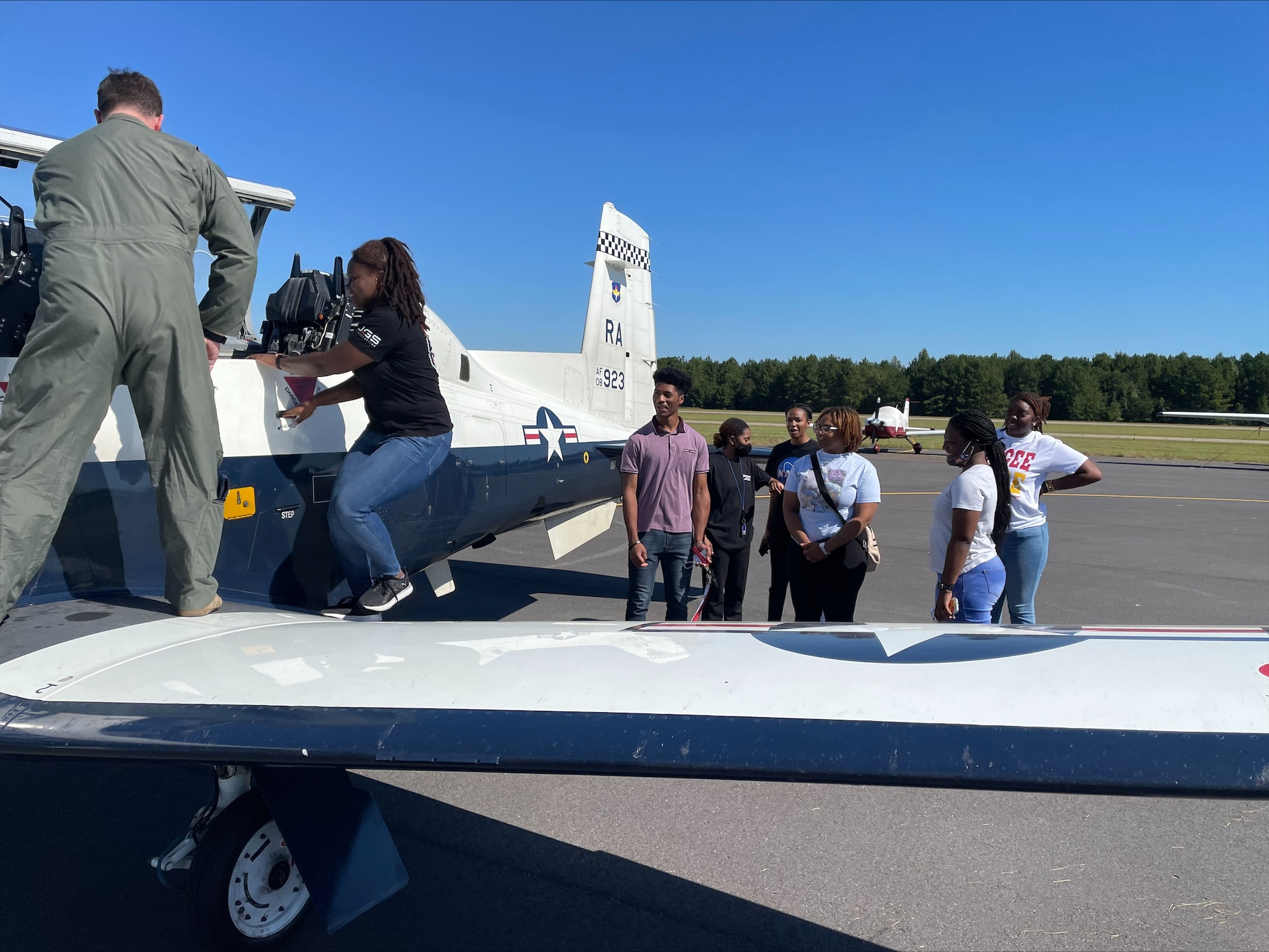Lt. Col. Michael Castlen, the 12th TRS commander, introduces Tuskegee University students to the T-6 Texan. (Courtesy Photo)