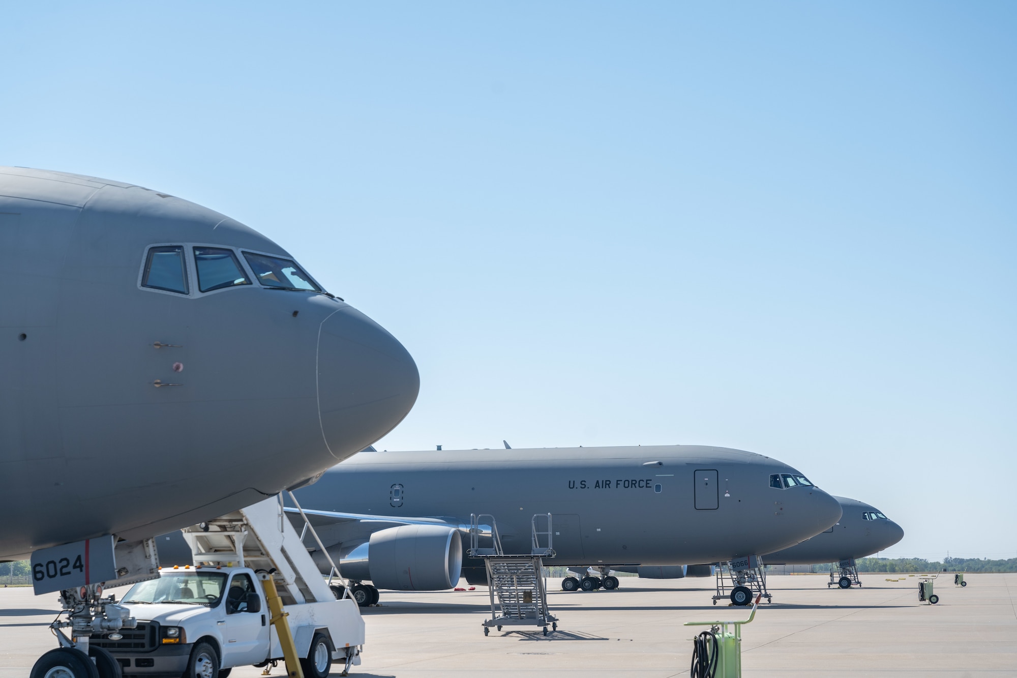 Three KC-46As assigned to the 916th Air Refueling Wing sit on the ramp after landing on Sep. 29, 2022, at McConnell Air Force Base, Kansas. Before hurricane Ian could strike, nine airframes were sent out of an abundance of caution from Seymour Johnson Air Force Base, North Carolina. (U.S. Air Force photo by Staff Sgt. Nathan Eckert)