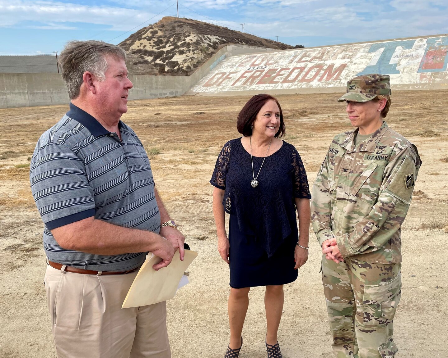 Col. Julie Balten, U.S. Army Corps of Engineers Los Angeles District commander, speaks with Riverside County Supervisor Karen Spiegel and U.S. Rep. Ken Calvert (CA-42) after the Sept. 8 Prado Dam mural groundbreaking ceremony in Corona, California. The event included officials from Riverside, Orange and San Bernardino counties, as well as other local city mayors and leaders.