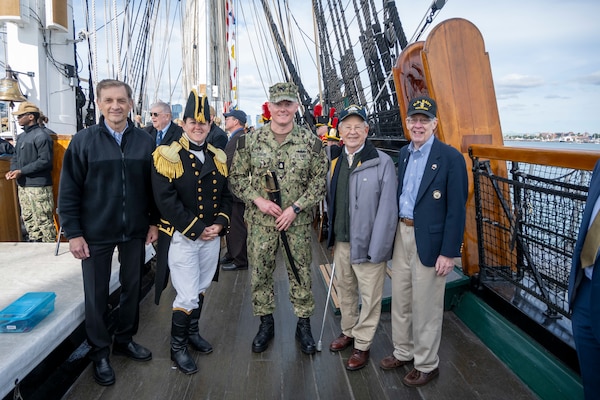 BOSTON (Sept. 30, 2022) Chief Gas Turbine Systems Technician (Mechanical) Adam Yenny poses with current and former Navy leadership after receiving the 2021 USS Constitution George Sirian Meritorious Leadership Award while underway aboard USS Constitution. The USS Constitution George Sirian Meritorious Leadership Award recognizes a chief petty officer who embodies former USS Constitution crew member George Sirian through their technical expertise, dedication, and leadership. USS Constitution, is the world’s oldest commissioned warship afloat, and played a crucial role in the Barbary Wars and the War of 1812, actively defending sea lanes from 1797 to 1855. During normal operations, the active-duty Sailors stationed aboard USS Constitution provide free tours and offer public visitation to more than 600,000 people a year as they support the ship’s mission of promoting the Navy’s history and maritime heritage and raising awareness of the importance of a sustained naval presence. USS Constitution was undefeated in battle and destroyed or captured 33 opponents. The ship earned the nickname of Old Ironsides during the war of 1812 when British cannonballs were seen bouncing off the ship’s wooden hull. (U.S. Navy Photo Illustration by Mass Communication Specialist 1st Class Grant G. Grady/Released)