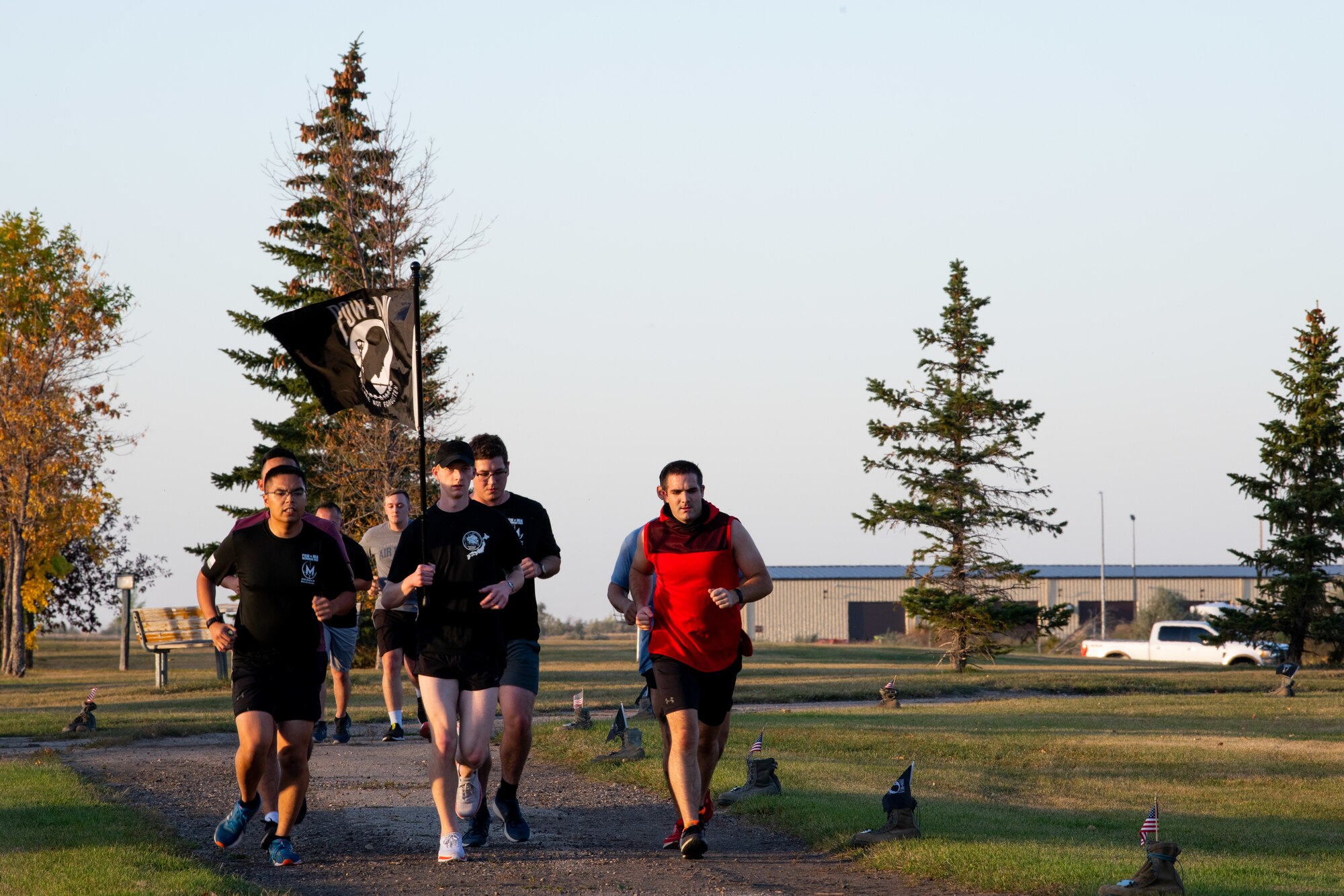 Team Minot Airmen participate in a POW/MIA commemoration run, Minot Air Force Base, North Dakota, Sept. 29, 2022.