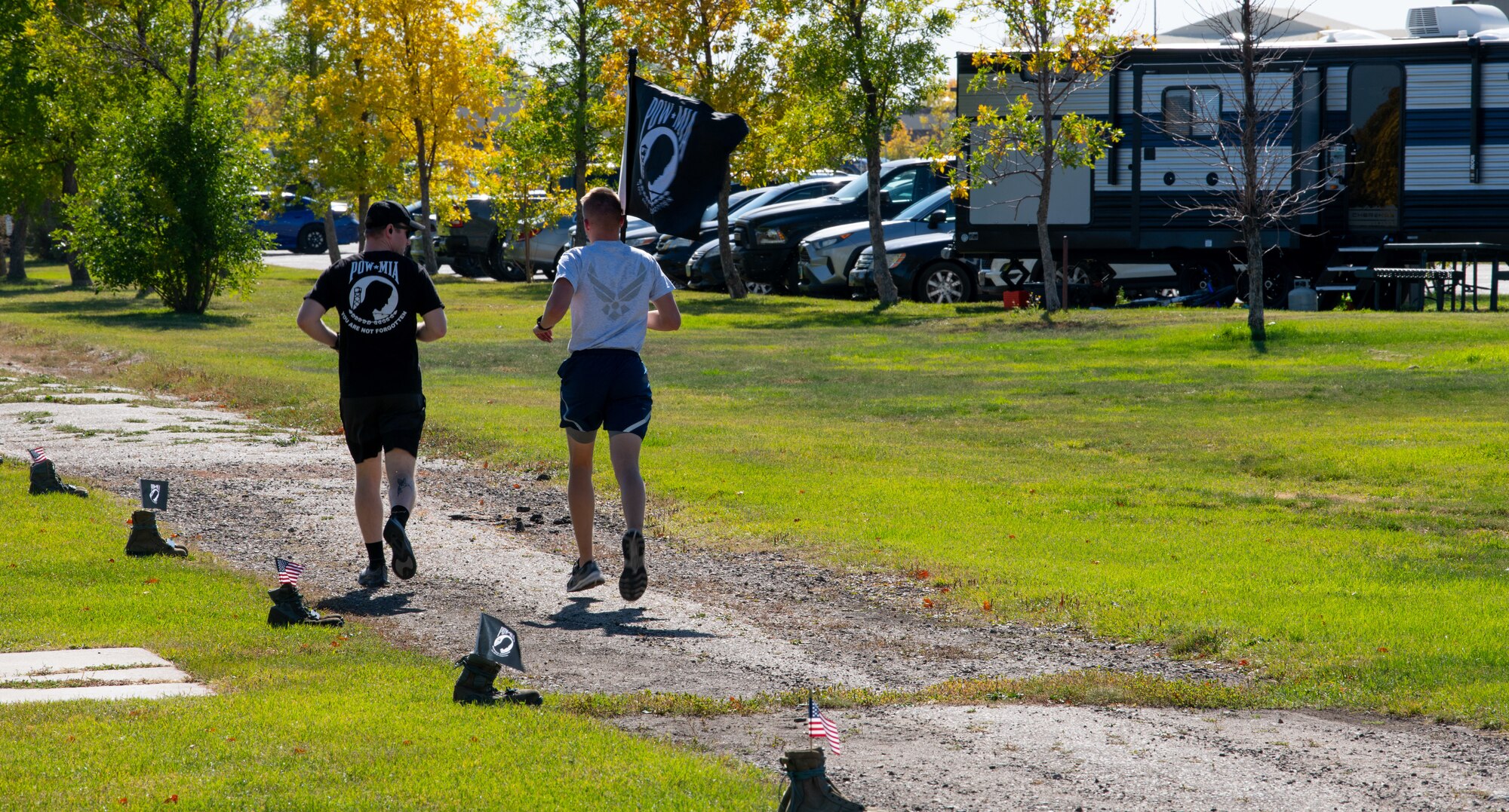 Team Minot Airmen participate in a POW/MIA commemoration run, Minot Air Force Base, North Dakota, Sept. 29, 2022.