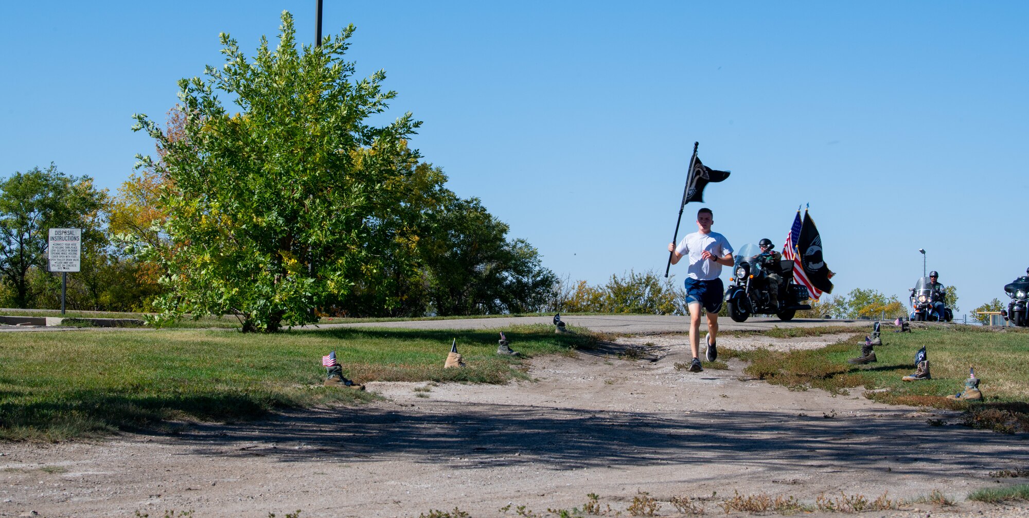 Team Minot Airmen participate in a POW/MIA commemoration run, Minot Air Force Base, North Dakota, Sept. 29, 2022.