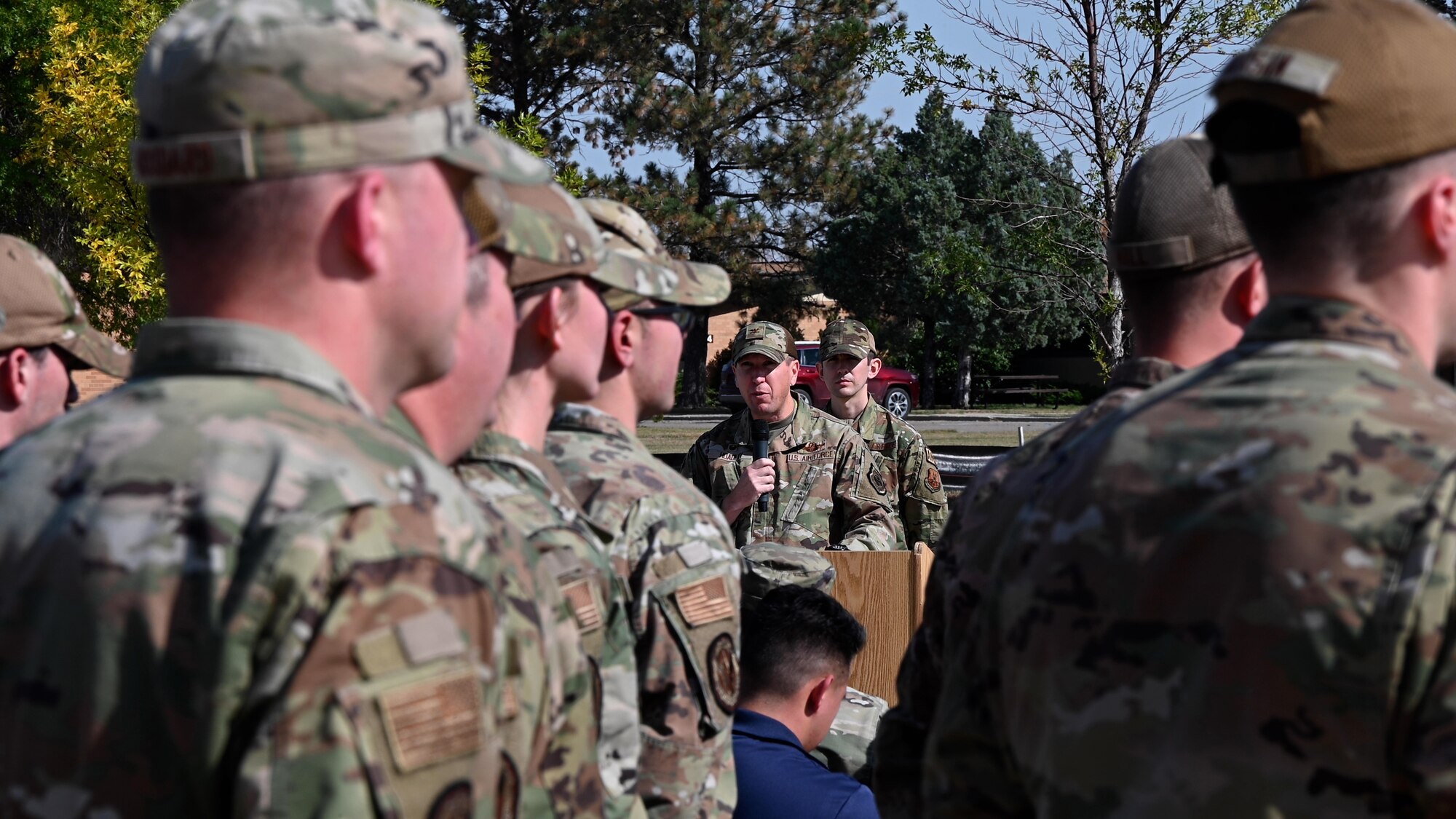 Col. Daniel Hoadley, 5th Bomb Wing commander, gives remarks during a retreat ceremony for National POW/MIA Recognition Day at Minot Air Force Base, North Dakota, Sept. 30, 2022.