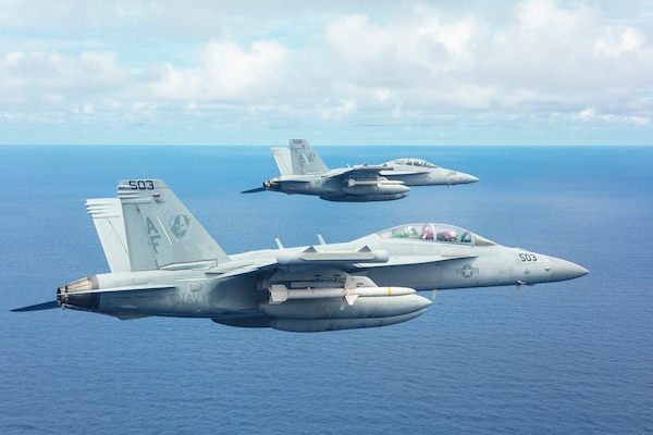 EA-18G Growlers from the "Star Warriors" of Electronic Attack Squadron (VAQ) 209 simultaneously fire two AGM-88 High Speed Anti-Radiation Missiles (HARM) during a training exercise near Guam. The AGM-88 HARM is a tactical air-to-surface missile which finds and destroys threat radar air defense systems. Supporting a free and open Indo-Pacific and operating out of Andersen Air Force Base on the "Forward Edge" while utilizing the Marianas Islands Range Complex, VAQ-209's live-fire exercise provided valuable training to ordnance personnel and aircrew alike. As the US Military's only Reserve EA-18G squadron, VAQ-209 is currently forward deployed to Japan and operating across the Indo-Pacific as the expeditionary VAQ squadron currently assigned to Commander, Task Force (CTF) 70. (U.S. Navy photo by Cmdr. Peter Scheu)