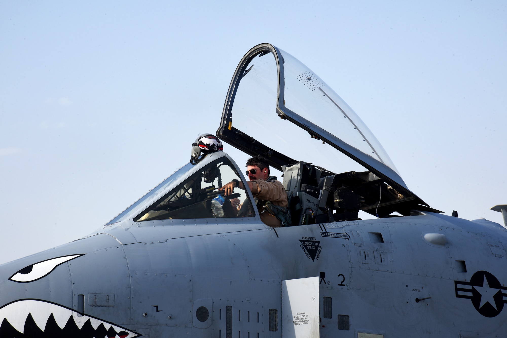 U.S. Air Force Lt. Col. E. Aaron Brady, 75th Expeditionary Fighter Squadron commander, prepares to deplane following his arrival at Al Dhafra Air Base, United Arab Emirates, March 31, 2023. The arrival of the A-10 Thunderbolt IIs in the Middle East provide additional capabilities for U.S. Air Forces Central as well as providing the close air support (CAS) pilots opportunities to build upon their skillsets outside of the U.S. (U.S. Air Force photo by Tech. Sgt. Chris Jacobs/released)