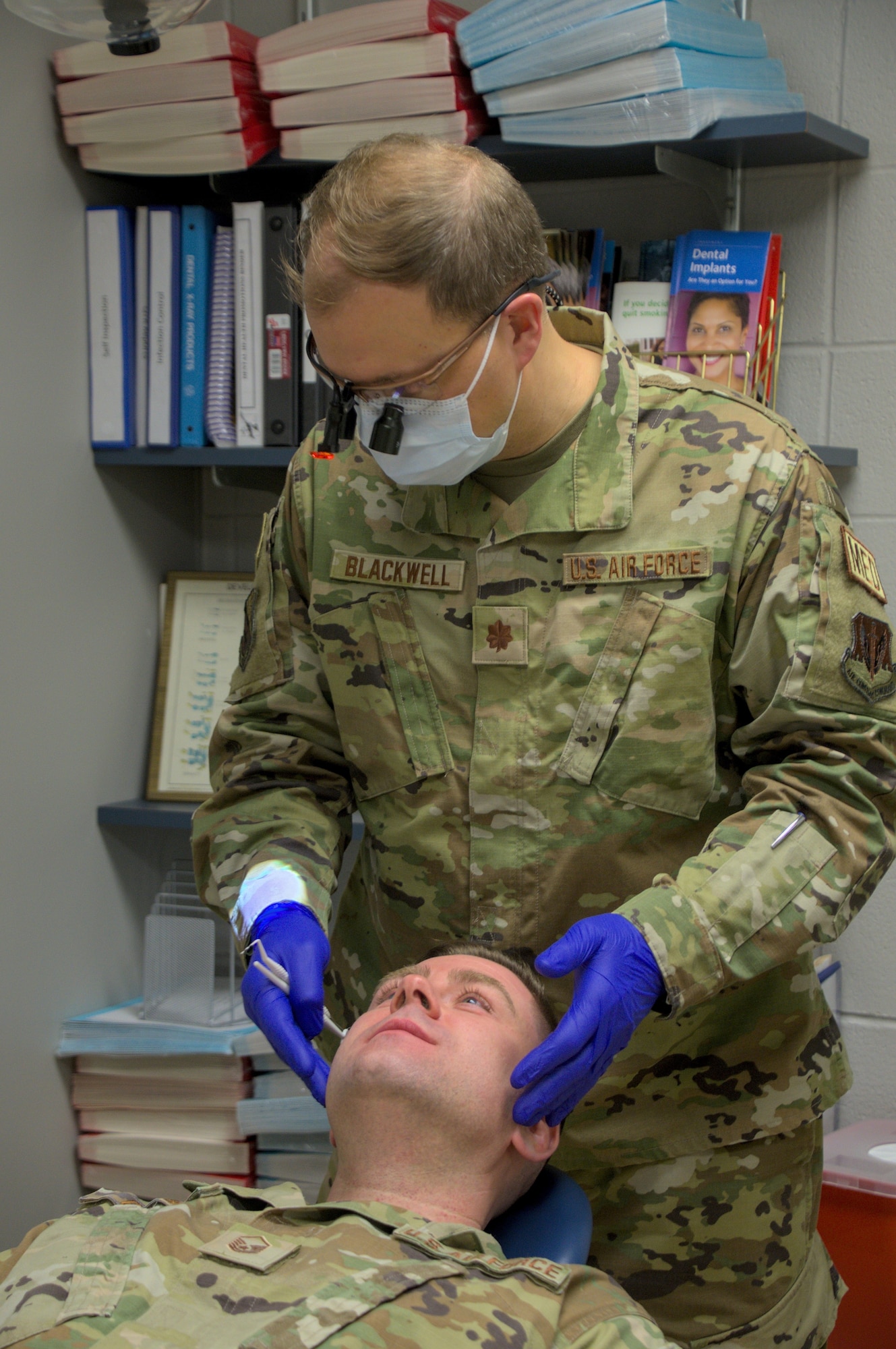 U.S. Air Force Maj. Andrew Blackwell, 104th Medical Group dental officer, conducts an exam on U.S. Air Force Master Sgt. Christopher Catyb, Mission Support Group training manager, during the annual Periodic Health Assessments, March 4, 2023, at Barnes Air National Guard Base, Mass. Dental exams ensure Airmen do not have dental or periodontal issues, such as cavities, which may put them at risk of becoming non-deployable or that may require further attention. (U.S. Air National Guard Photo by Staff Sgt. Sara Kolinski)