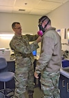 U.S. Air Force Capt. Nathaniel Donnachie, 104th Medical Group bioenvironmental engineer, conducts respirator testing with U.S. Air Force Airman 1st Class Noah Leobel, 104th Maintenance Group aircraft fuel systems specialist, during the annual Periodic Health Assessments, March 4, 2023, at Barnes Air National Guard Base, Massachusetts. Respirator testing is completed to ensure the proper fit and functionality of protective equipment for Airmen who work around hazardous chemicals or within confined spaces. (U.S. Air National Guard Photo by Staff Sgt. Sarah Stec)