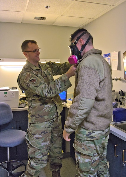 U.S. Air Force Capt. Nathaniel Donnachie, 104th Medical Group bioenvironmental engineer, conducts respirator testing with U.S. Air Force Airman 1st Class Noah Leobel, 104th Maintenance Group aircraft fuel systems specialist, during the annual Periodic Health Assessments, March 4, 2023, at Barnes Air National Guard Base, Massachusetts. Respirator testing is completed to ensure the proper fit and functionality of protective equipment for Airmen who work around hazardous chemicals or within confined spaces. (U.S. Air National Guard Photo by Staff Sgt. Sarah Stec)