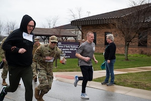 Runners take off from the starting line during the SAPR .5k race.