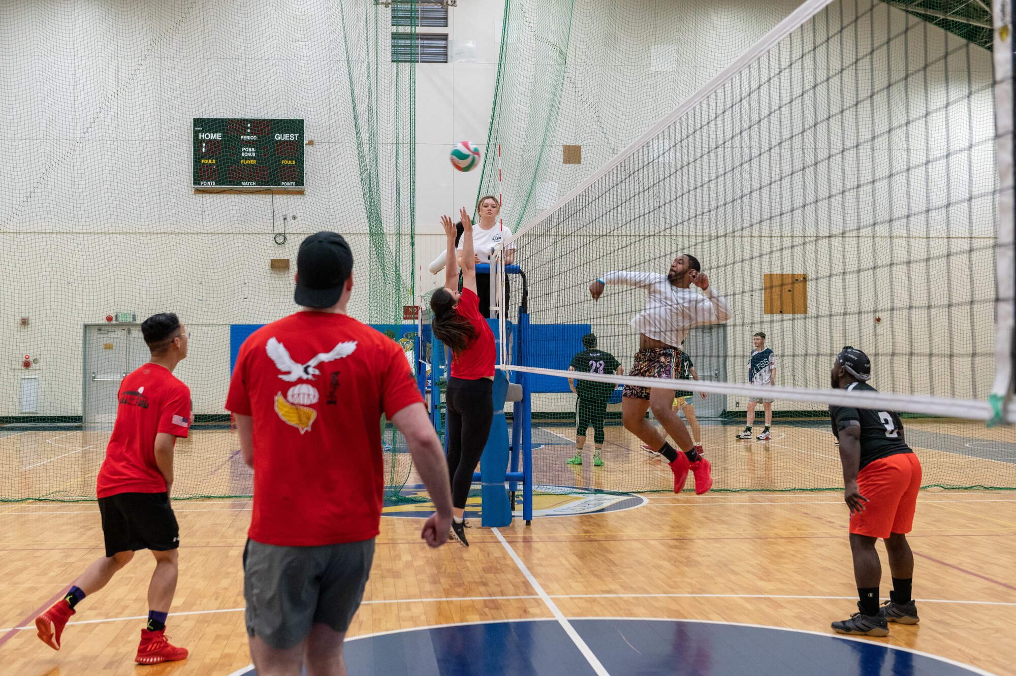 Airmen compete in a volleyball tournament.