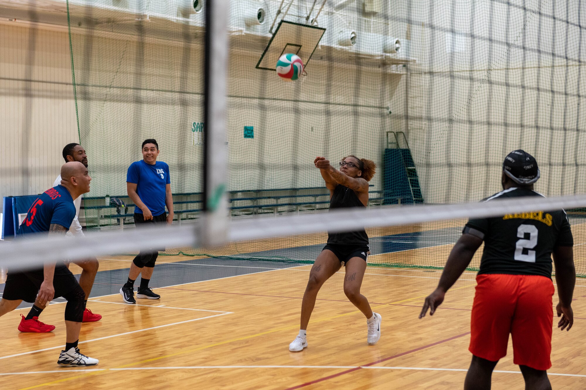 Airmen compete in a volleyball tournament.