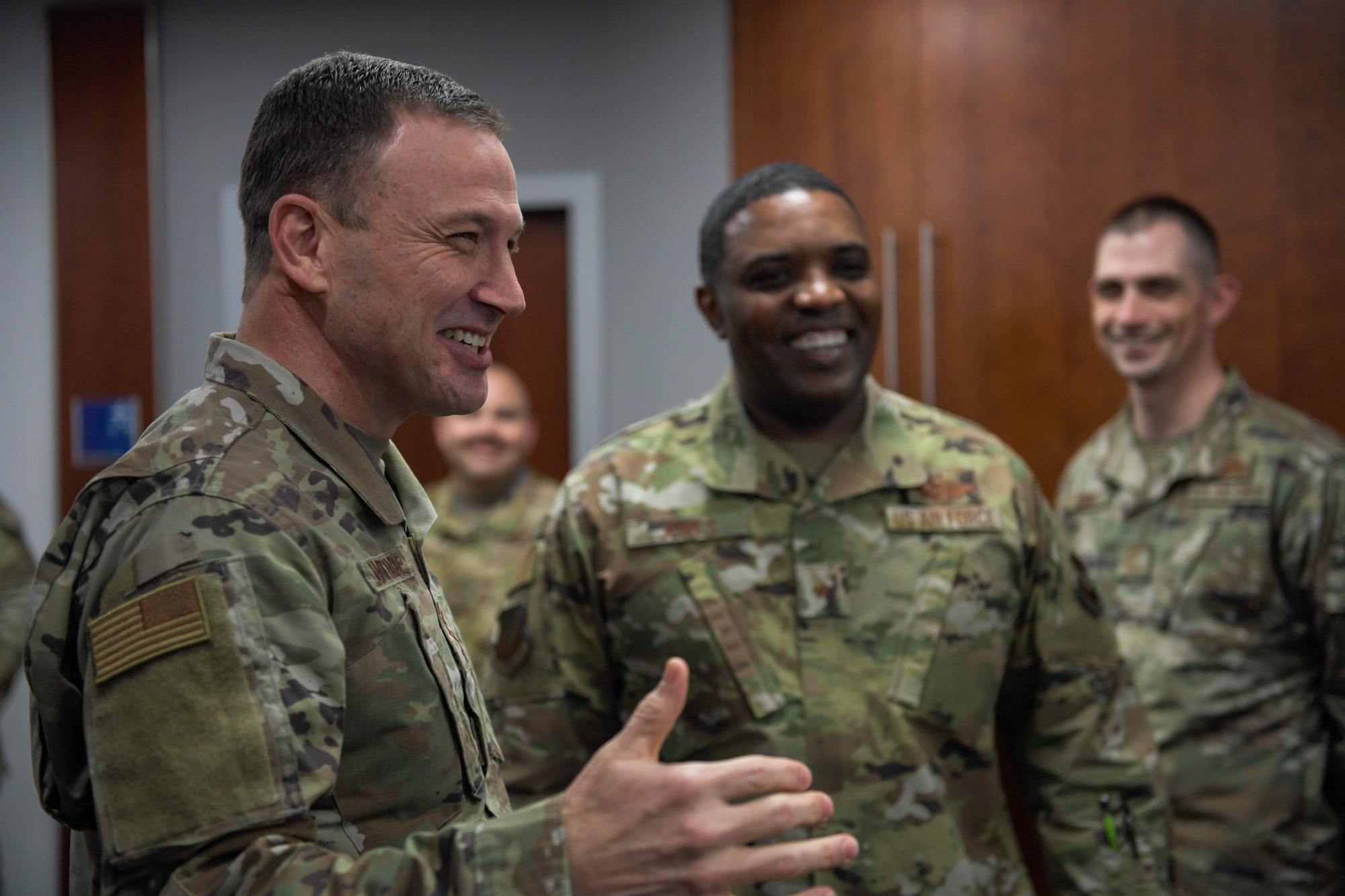 Airmen smile and talk.