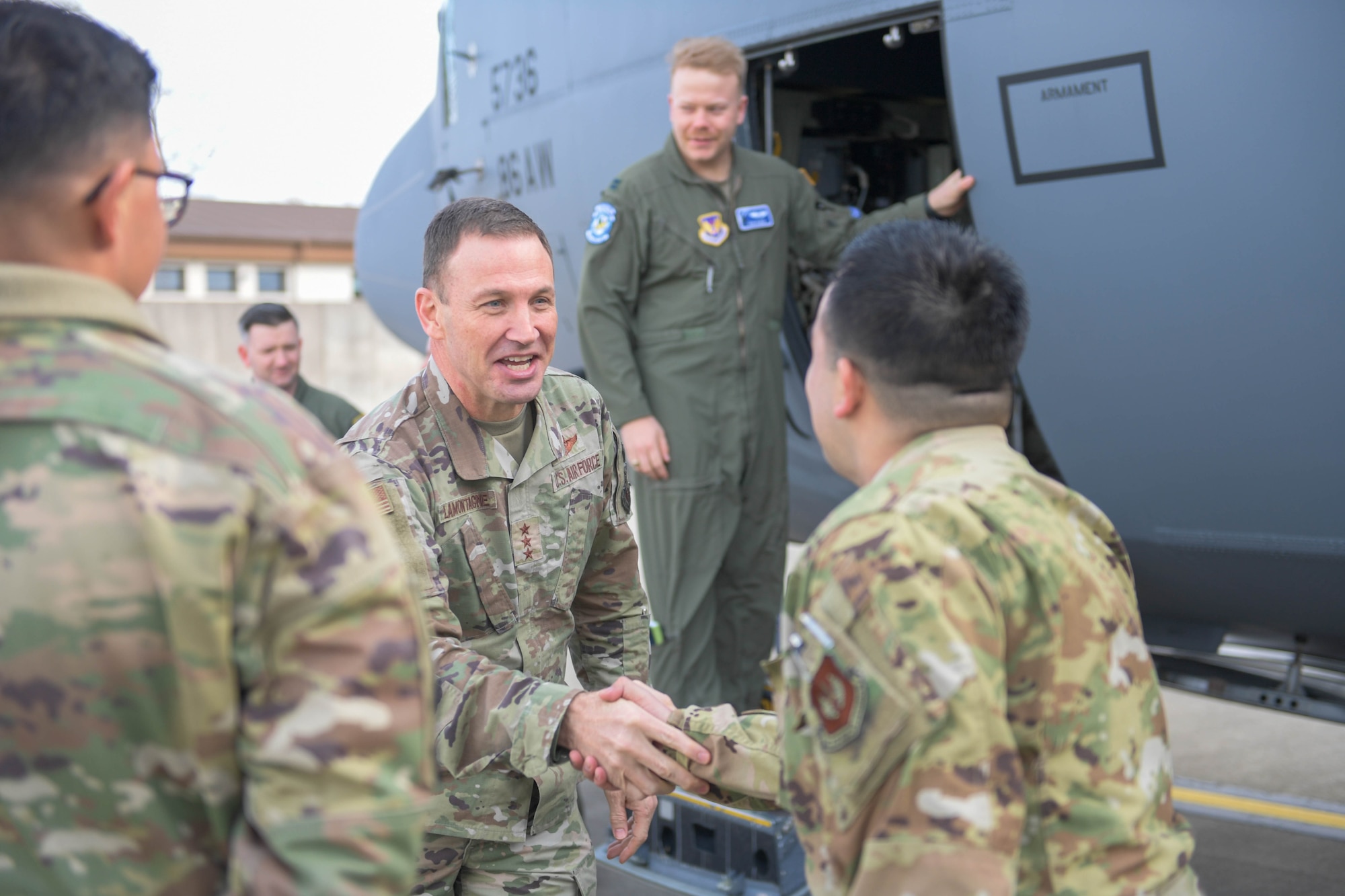 Airman shake hands.