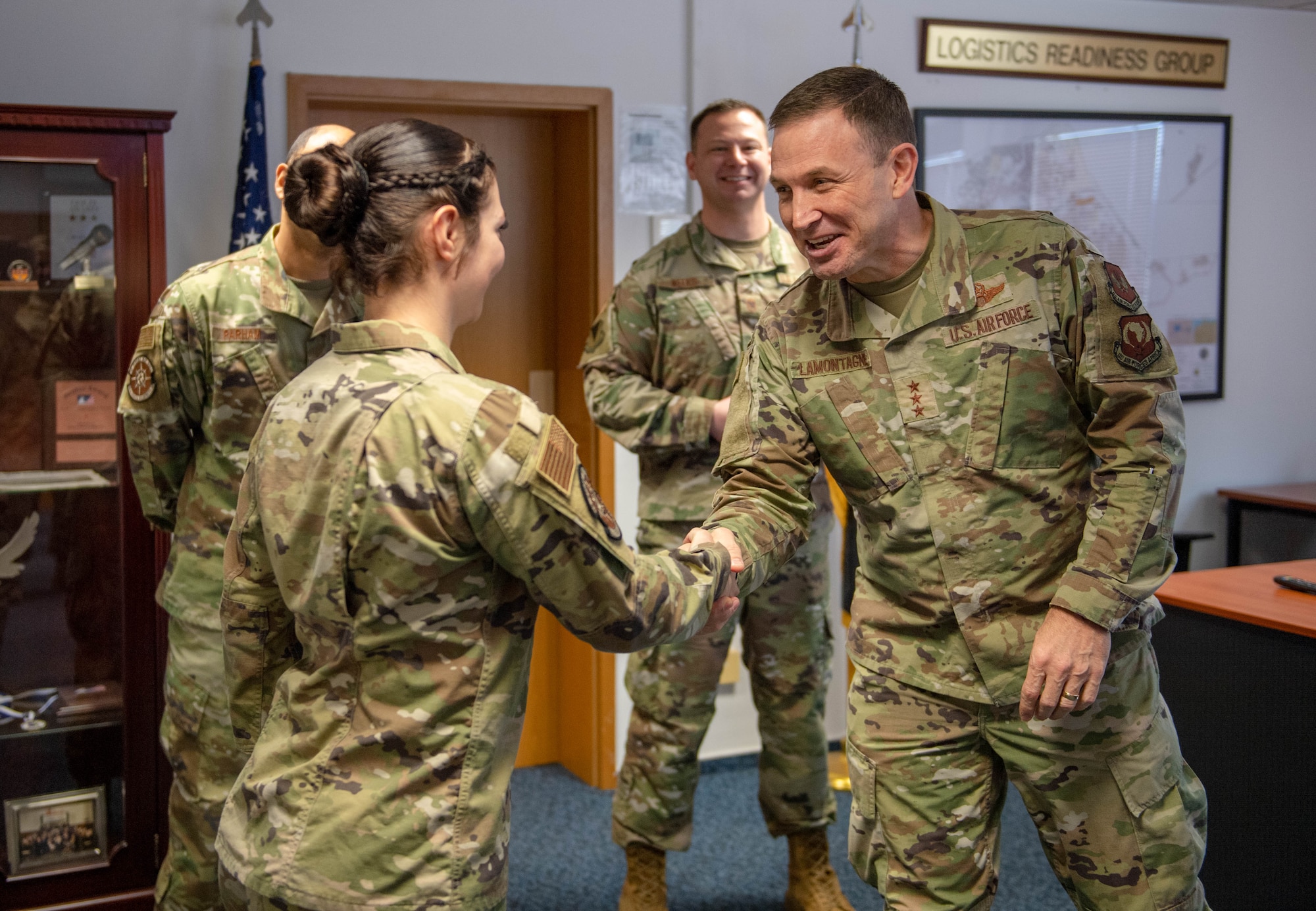 Airmen shake hands.