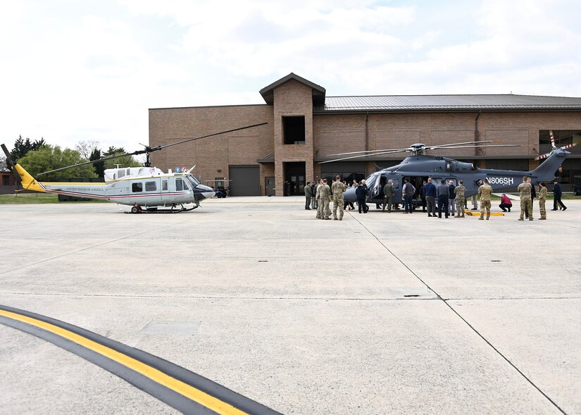 A UH-1N Iroquois helicopter, left, and an MH-139 Grey Wolf are toured by Team Joint Base Andrews members at JBA, Md., March 28, 2023.