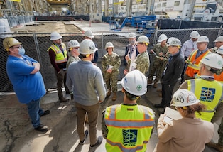 The Honorable Erik Raven, Under Secretary of the Navy; Adm. Lisa Franchetti, Vice Chief of Naval Operations; and Rear Adm. Dean VanderLey, commander, Naval Facilities Engineering Systems Command, discuss ongoing construction work in the Machine Shop, Building 431, at Puget Sound Naval Shipyard & Intermediate Maintenance Facility in Bremerton, Washington, March 29, 2023. (U.S Navy Photo by Wendy Hallmark)