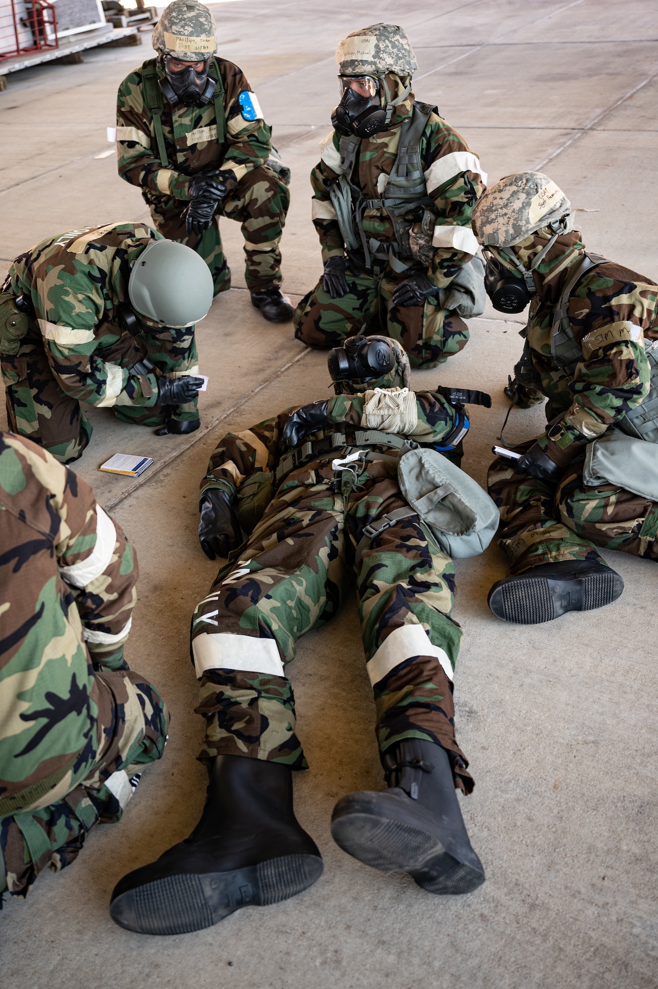 Maintainers assigned to the 130th Maintenance Group, Charleston, W.Va., practice tactical combat casualty care after a simulated attack during the unit’s Fly Away Readiness Exercise  March 30, 2023, at the Combat Readiness Training Center in Gulfport, Miss. FLARE is a commander-directed readiness exercise to inform commanders of their units’ ability to deploy using the Agile Combat Employment model.