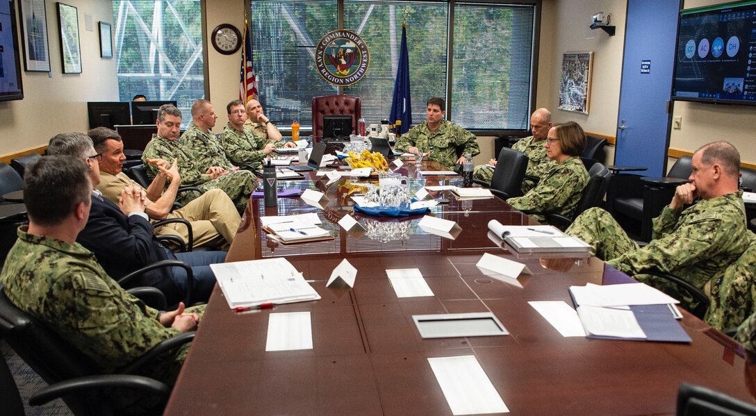 Vice Chief of Naval Operations Adm. Lisa Franchetti, second from right, listens to Commander, Navy Region Northwest Rear Adm. Mark Sucato, during a meeting at Navy Region Northwest Headquarters, March 29, 2023, at Naval Base Kitsap-Bangor, Washington. Franchetti visited the Pacific Northwest to learn more about challenges facing Sailors in the Navy’s third largest Fleet concentration area. (U.S. Navy photo by Chief Mass Communication Specialist Alan Gragg)