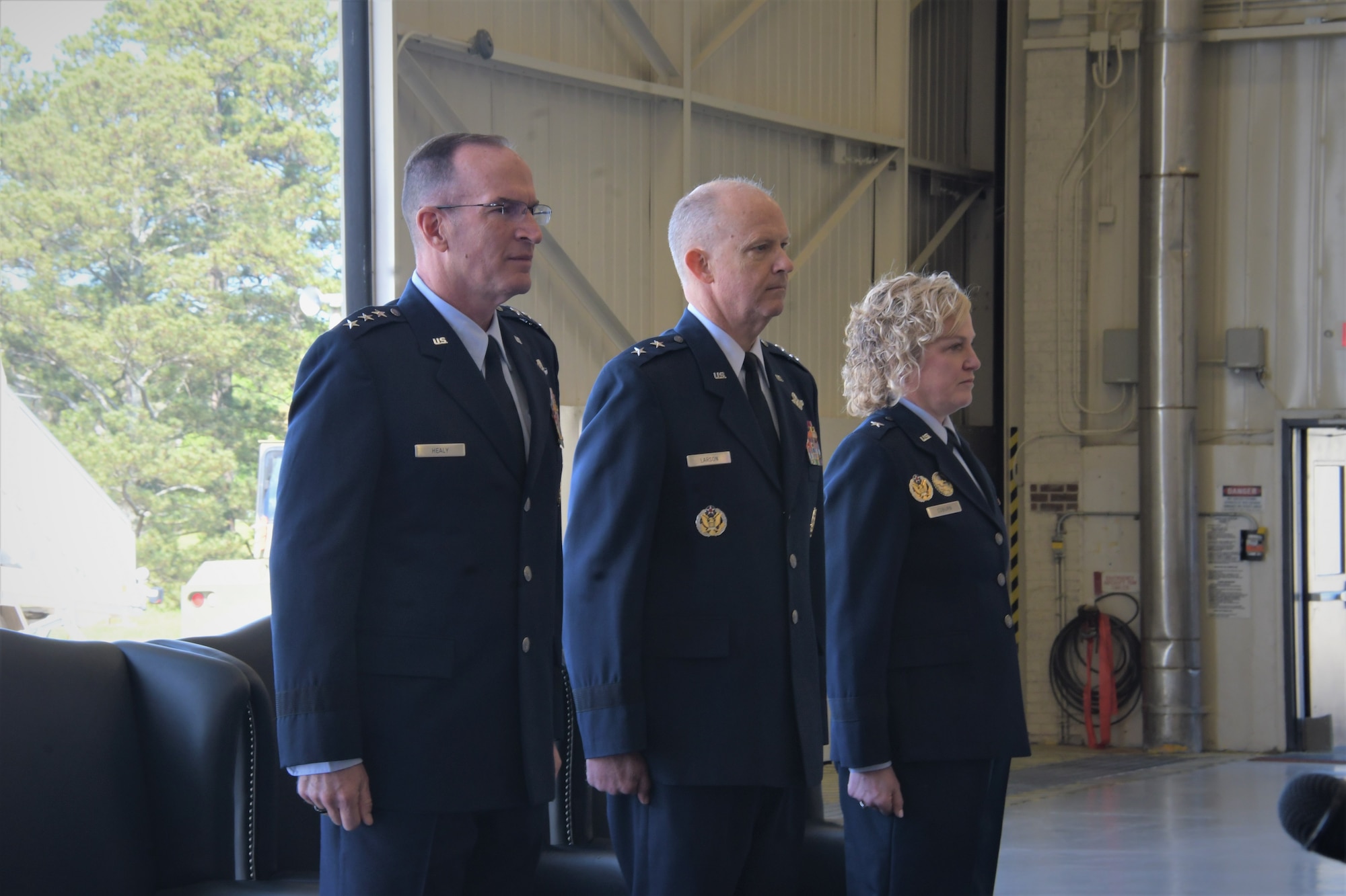 Brig. Gen. Melissa A. Coburn (right) prepares to take command of 22nd Air Force from Maj. Gen. Bret C. Larson (center) during a ceremony at Dobbins Air Reserve Base, Georgia, April 2. 2023. The ceremony was officiated by Lt. Gen. John P. Healy (left) commander of Air Force Reserve and Chief of the Air Force Reserve.