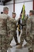 U.S. Army Col. L. Allen Joiner, outgoing commander of the 238th Regiment passes the regimental guidon to Brig. Gen Brian Wertzler, Kentucky National Guard deputy adjutant general, symbolizing the relinquishing of his command of the unit at the 238th Regiment’s Change of Command ceremony held at the Wendell H. Ford Regional Training Center, Greenville, Ky., March 25, 2023. (U.S. Army National Guard by Lt. Col. Carla Raisler)