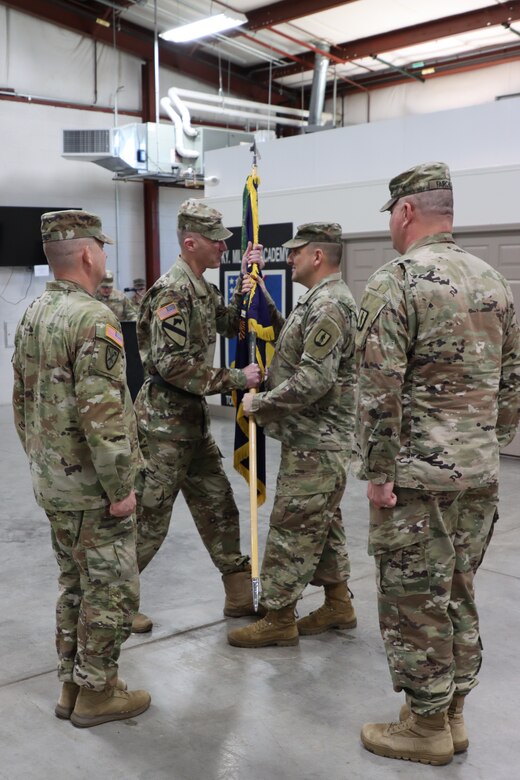U.S. Army Lt. Col. Philip Robinson, incoming commander of the 238th Regiment receives the regimental colors from Brig. Gen Brian Wertzler, Kentucky National Guard deputy adjutant general, at the 238th Regiment’s Change of Command ceremony held at the Wendell H. Ford Regional Training Center, Greenville, Ky., March 25, 2023. (U.S. Army National Guard by Lt. Col. Carla Raisler)
