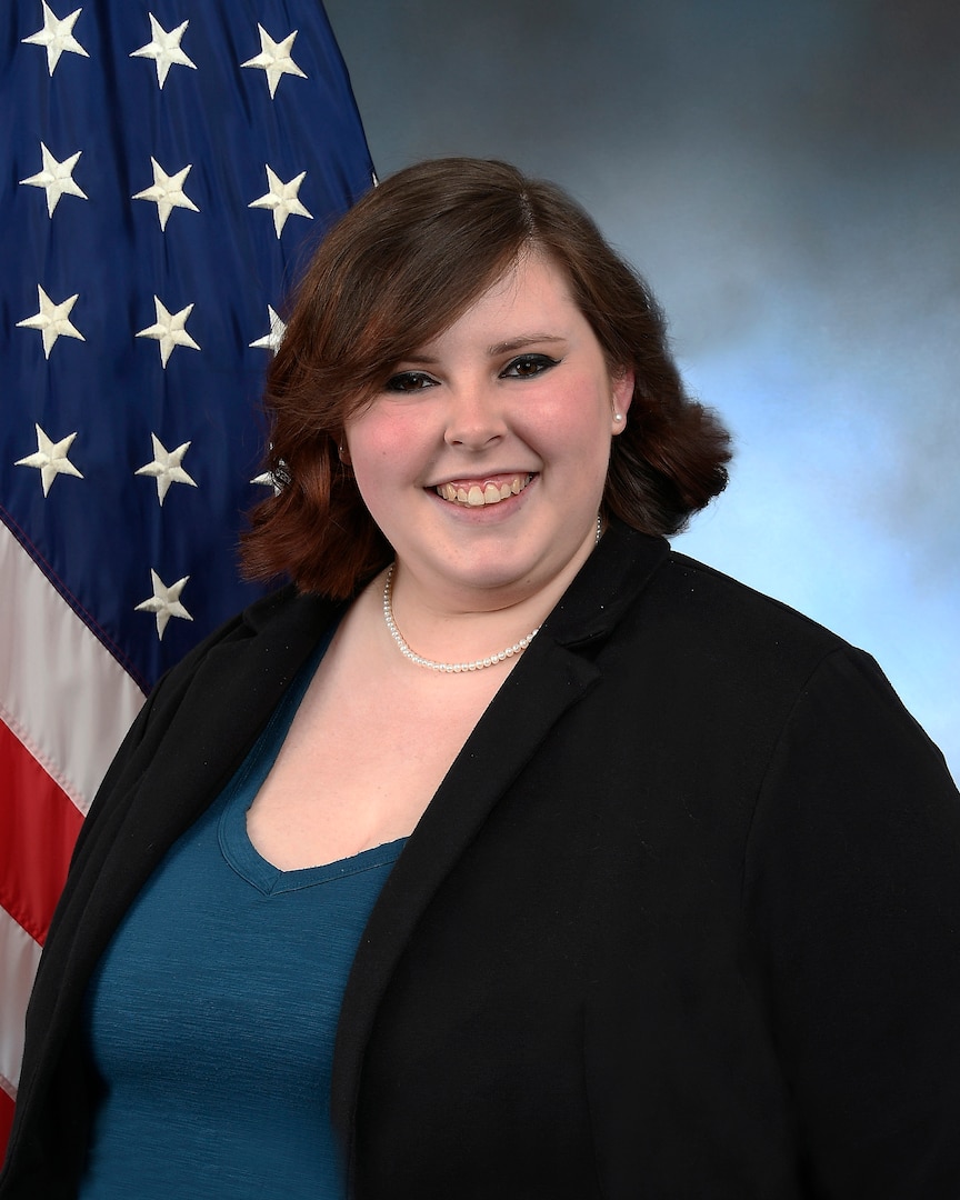 Professional portrait of female with flag in the background