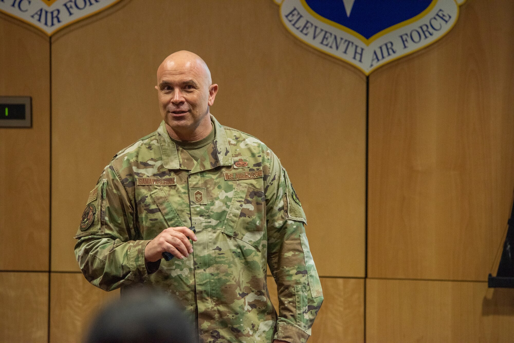 U.S. Air Force Chief Master Sgt. Jalil Samavarchian, Chief of Headquarters Air Force Enlisted Force Development, briefs Airmen and officers during an enlisted force development panel at Joint Base Elmendorf-Richarson, Alaska, March 30, 2023.