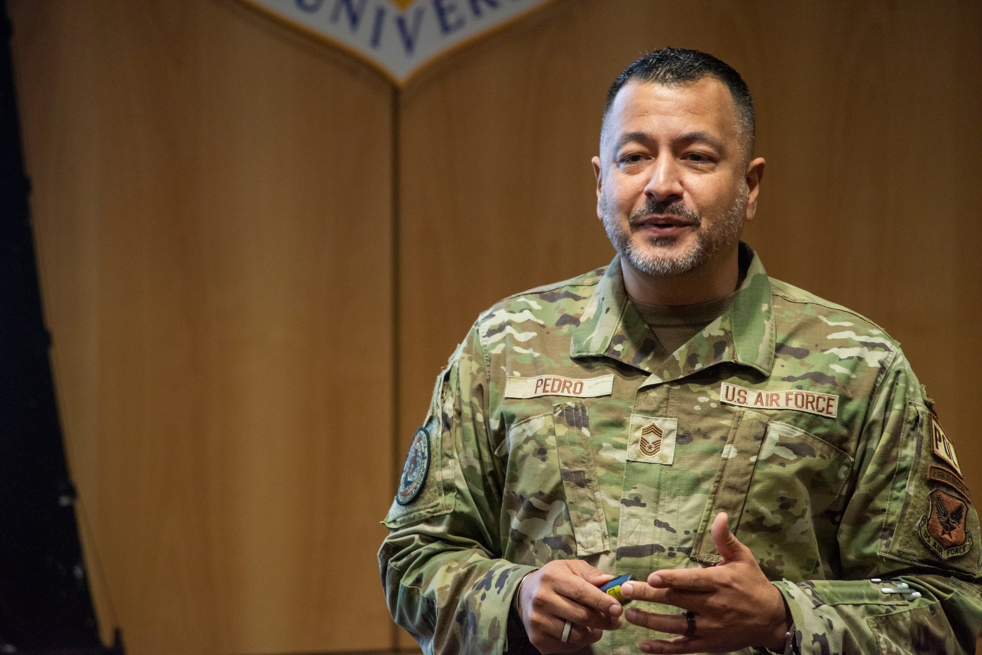 U.S. Air Force Chief Master Sgt. Donald Pedro, Senior Enlisted Leader to the Secretary of the Air Force, Office of Diversity and Inclusion, briefs Airmen and officers during an enlisted force development panel at Joint Base Elmendorf-Richarson, Alaska, March 30, 2023.