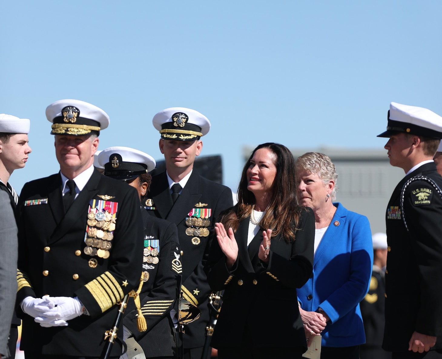 PORT HUENEME, Calif. (Apr 1, 2023) Adm. Samuel J. Paparo, commander, U.S. Pacific Fleet, left, Cdr. Brian Sparks, commanding officer, Independence-class variant littoral combat ship USS Santa Barbara (LCS32), center, Lola Zinke, ships sponsor, and Congresswoman Julia Brownley, prepare to take the stage during the LCS32 Commissioning Ceremony onboard Naval Base Ventura County (NBVC), Port Hueneme, Apr. 1, 2023. Littoral Combat Ships are fast, optimally-manned, mission-tailored surface combatants that operate in near-shore and open-ocean environments, winning against 21st-century coastal threats. LCS integrate with joint, combined, manned and unmanned teams to support forward presence, maritime security, sea control, and deterrence missions around the globe. NBVC is a strategically located Naval installation composed of three operating facilities: Point Mugu, Port Hueneme and San Nicolas Island. NBVC is the home of the Pacific Seabees, West Coast E-2D Hawkeyes, 3 warfare centers and 80 tenants. (U.S. Navy photo by Mass Communication 1st Class Douglas "Evan" Parker/Released)
