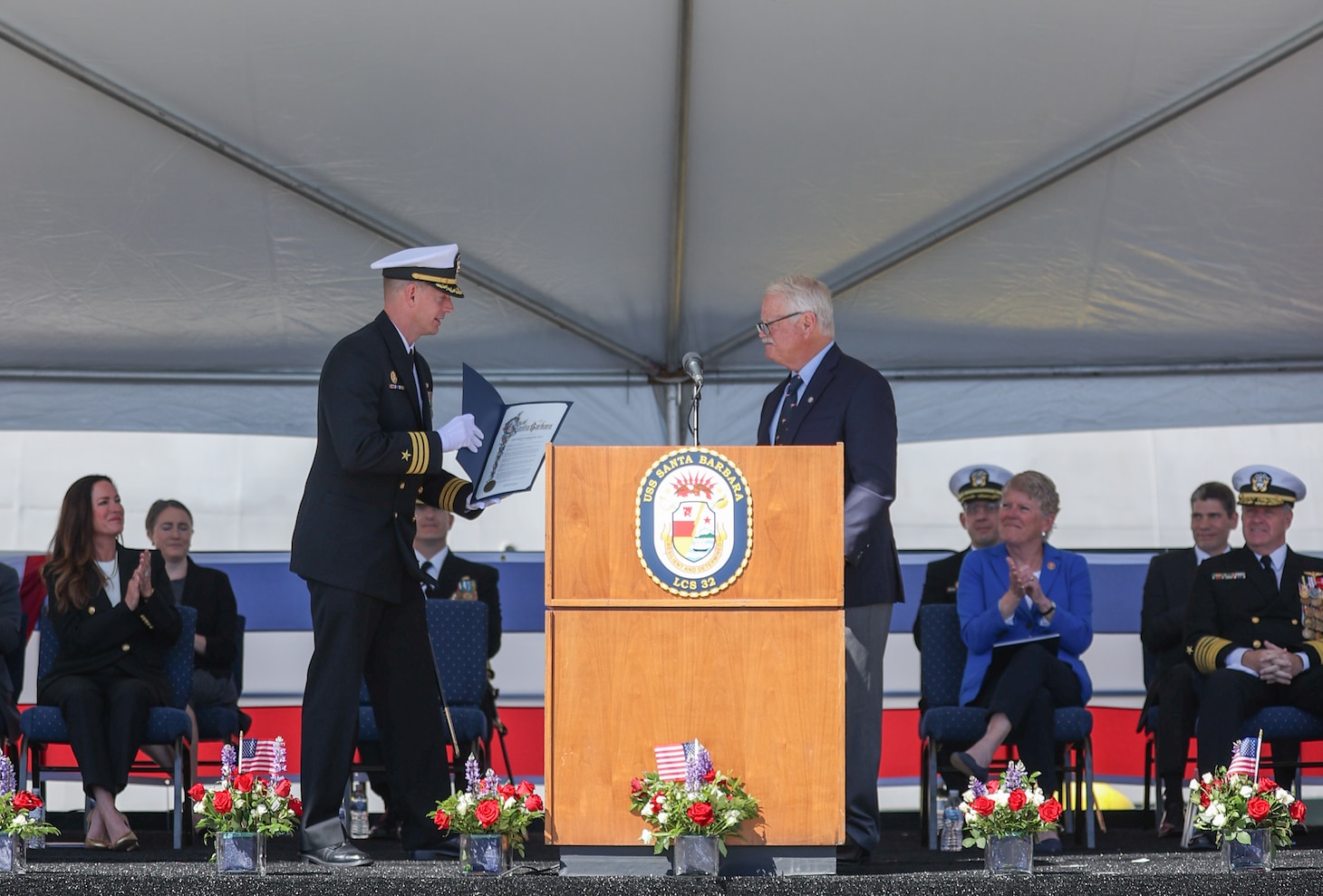 Cmdr. Brian Sparks, left, accepts a letter from Mayor Randy Rowse during the commissioning for USS Santa Barbara (LCS 32) at Naval Base Ventura County.