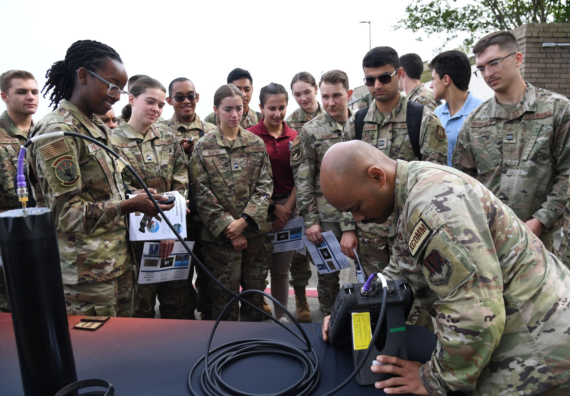 U.S. Air Force 2nd Lt. Dylan Seng, 85th Engineer Installation Squadron cyber engineer, provides a communications equipment demonstration to Air Force ROTC cadets during Pathways to Blue at Keesler Air Force Base, Mississippi, March 31, 2023.
