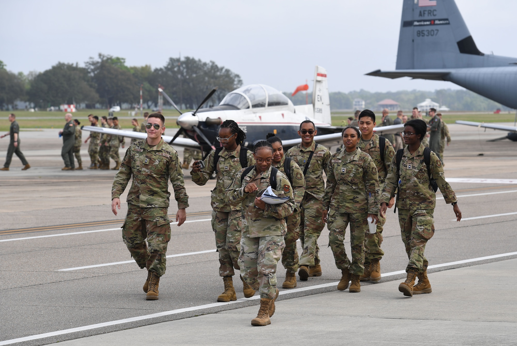 Air Force ROTC cadets walk across the flight line during Pathways to Blue at Keesler Air Force Base, Mississippi, March 31, 2023.