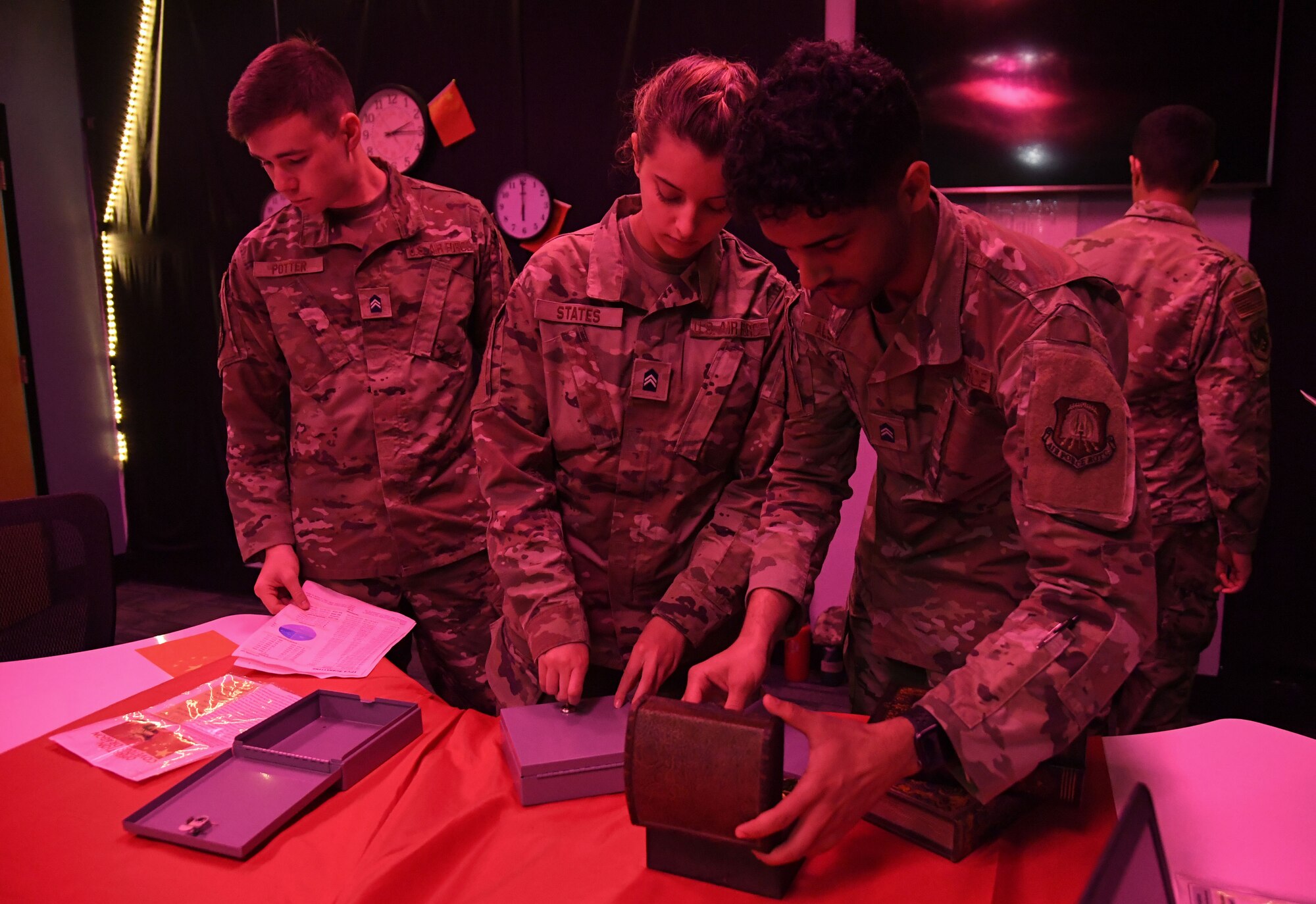 Joe Potter, Jessica States and Ahmed Alshariki, University of Alabama Air Force ROTC cadets, participate in the 333rd Training Squadron cyber escape room, during Pathways to Blue inside Stennis Hall at Keesler Air Force Base, Mississippi, April 1, 2023.