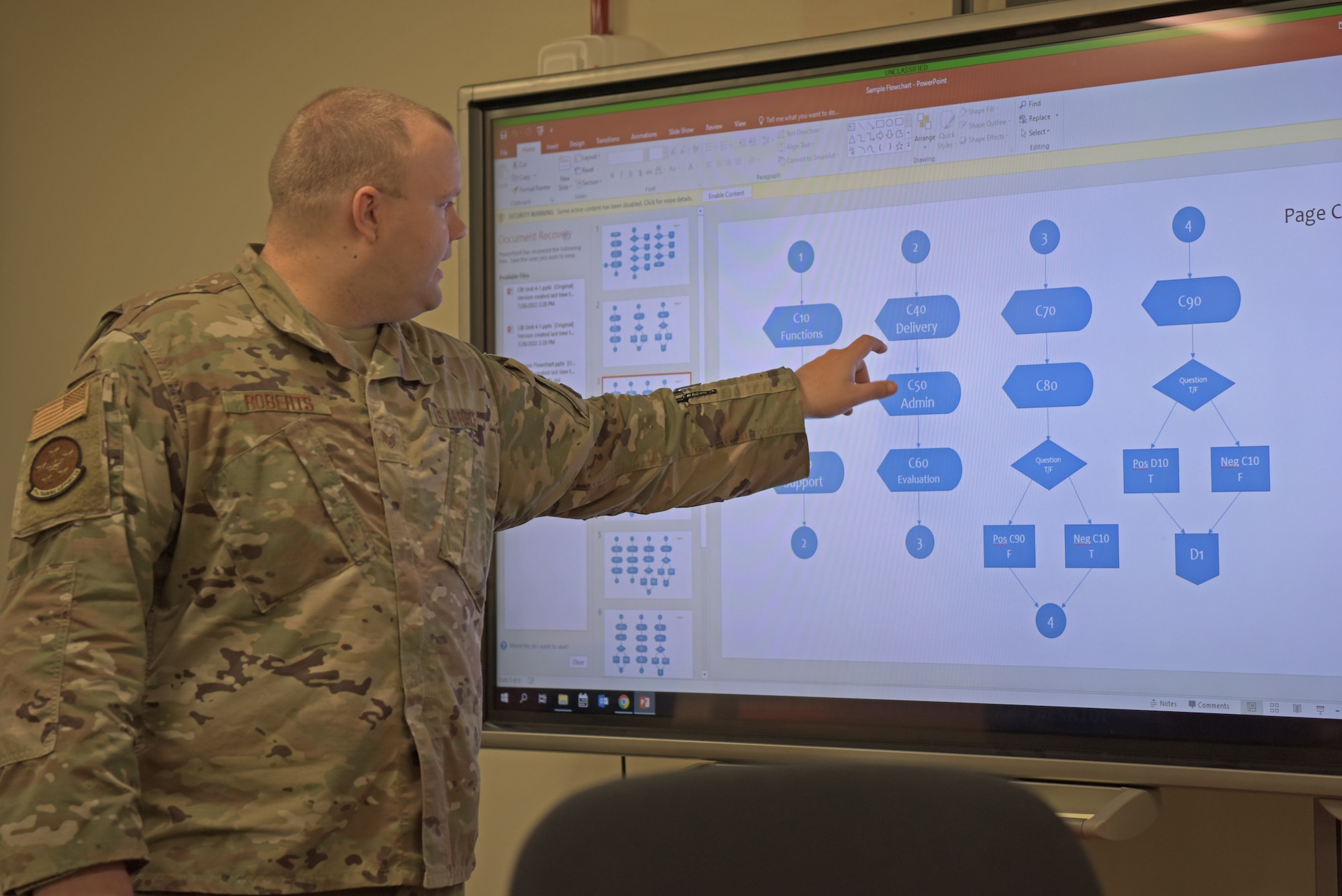 U.S. Air Force Staff Sgt. William Roberts, 17th Training Support Squadron instructor, speaks to the class at Goodfellow Air Force Base, Texas, March 24, 2023. Instructors in the Computer Based Instruction Designer course use flow charts to create a baseline for a course. (U.S. Air Force photo by Senior Airman Ashley Thrash)