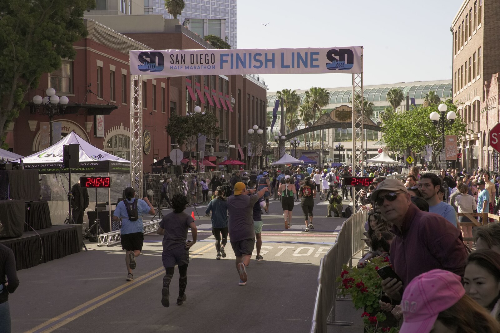 Fans cheer as runners complete the San Diego Half Marathon in downtown San Diego, March 26, 2023.